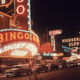 Neon signs advertising casinos and clubs on Fremont Street in Las Vegas, Nevada.